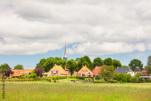 Summer view of the Dutch small terp village Niehove in the province of Groningen, The Netherlands photo