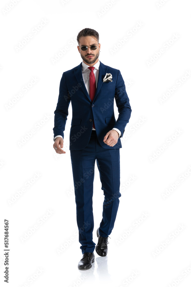 sexy confident businessman in suit with sunglasses walking sexy confident businessman in suit with sunglasses walking