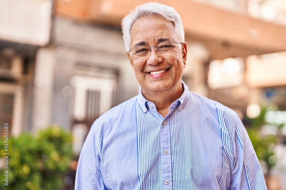 Obraz premium Senior man smiling confident standing at street