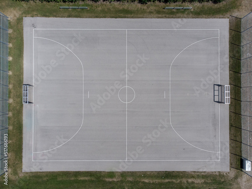 empty beton Football soccer field from aerial perspective in grey