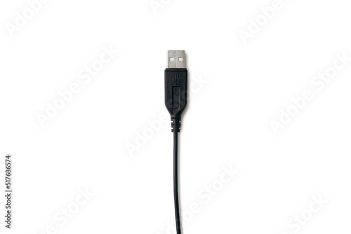Black USB cable on a white background in the center of the image. Modern technologies in everyday life. Compatible with many electronic devices. Cable for digital information transmission