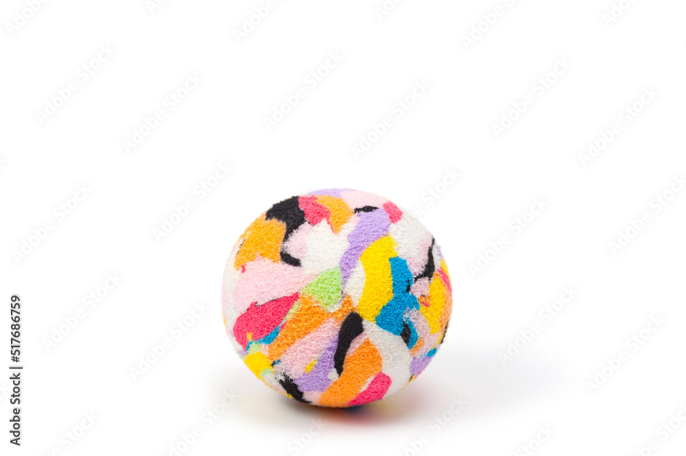 Multi-colored plastic ball with a soft fabric cover for playing with pets.