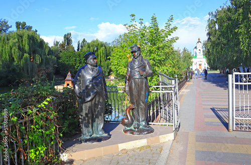 Sculptures of the literary personages of Gogol - Ivan Ivanovich and Ivan Nikiforovich near lake Mirgorodska Kalyuzha in Myrhorod, Ukraine  photo