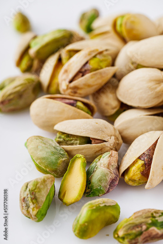fresh salted pistachios on a white background