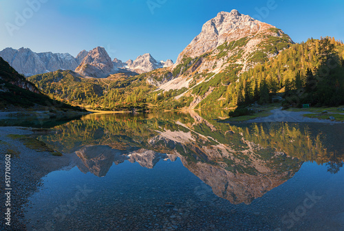 Fototapeta Naklejka Na Ścianę i Meble -  idyllic mountain lake Seebensee in the morning with perfect water reflection, austrian alps.