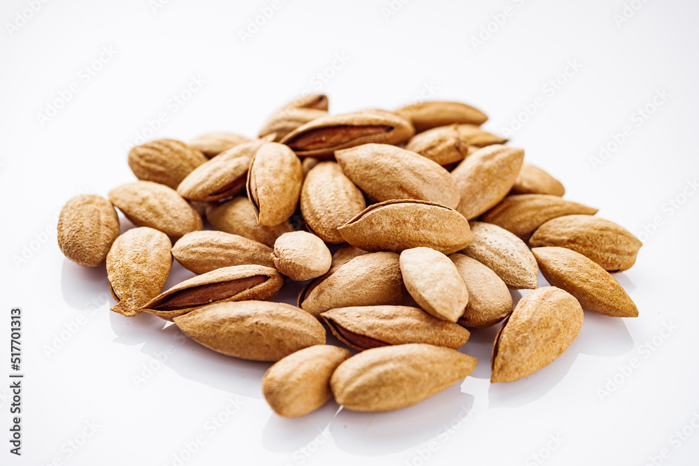 fresh almonds in shell on a white background fresh almonds in shell on a white background