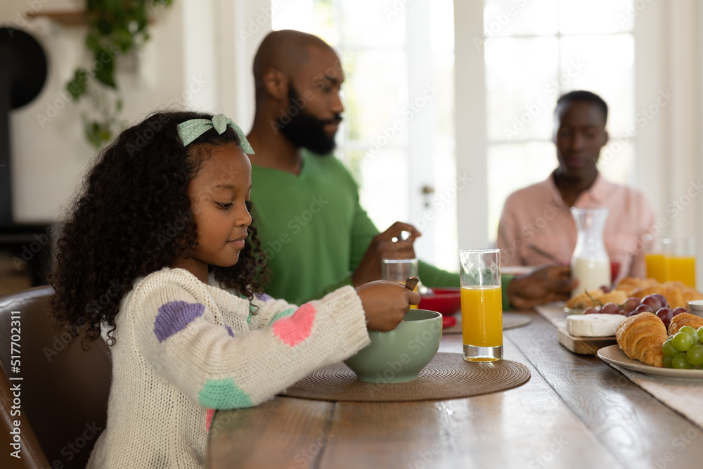 Image of happy multi generation african american family eating breakfast Image of happy multi generation african american family eating breakfast