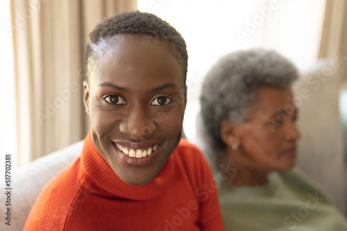 Image of happy african american woman smiling at camera © wavebreak3