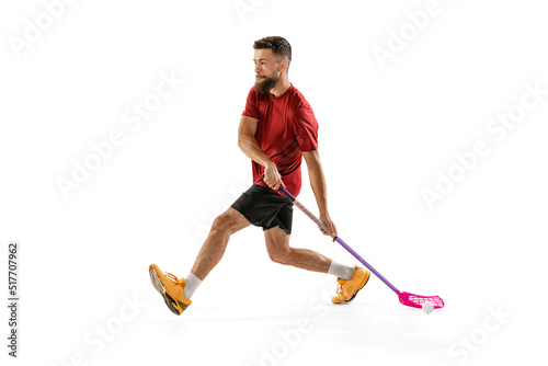 Принти на полотні Floorball male player with floorball stick training isolated on white studio background