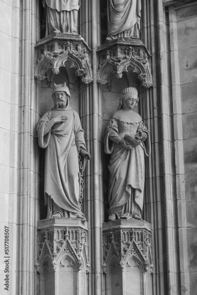 Sculptures on the North portal of the St. John's Cathedral in 's-Hertogenbosch, North Brabant, the Netherlands. The tympanum they are part of is richly decorated.