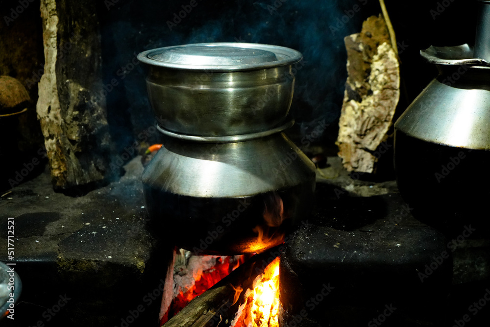 Food is prepared in an old village kitchen with firewood in Kerala Food is prepared in an old village kitchen with firewood in Kerala