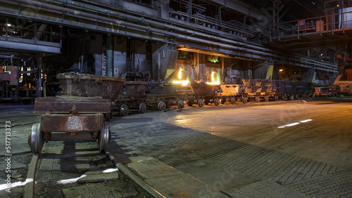 Trolleys with copper scrap in foundry workshop. photo