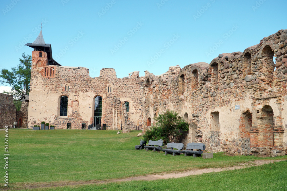 Dobele Castle Ruins in Latvia. The medieval stone walls with the central building in a panoramic view after restoration and rebuilding work.