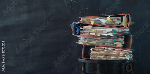 Heap of messy file folders,red tape, bureaucracy,bad aministration,business concept photo