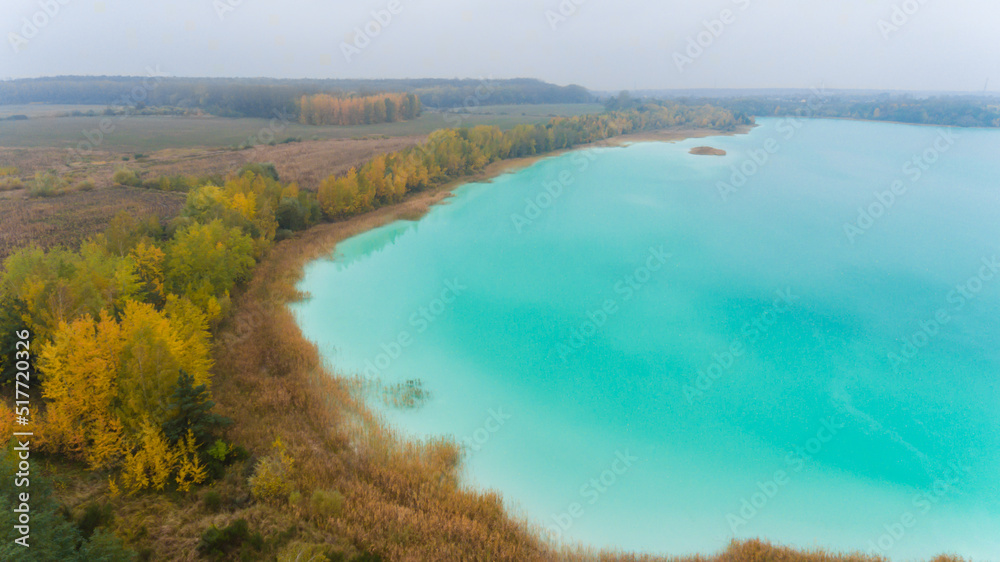 Top view aerial drone photo of lake with turquoise water