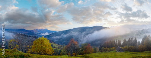 Misty early daybreak in autumn Carpathian mountain, Ukraine.