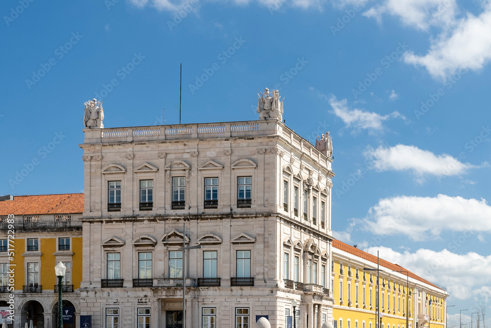 Lisboa, Portugal. April 9, 2022: Commerce square with sculpture with blue sky.
