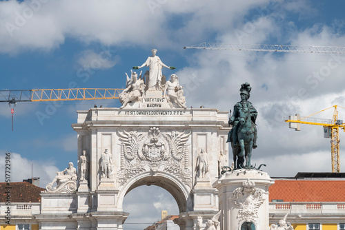 Lisboa, Portugal. April 9, 2022: Commerce square with sculpture with blue sky.