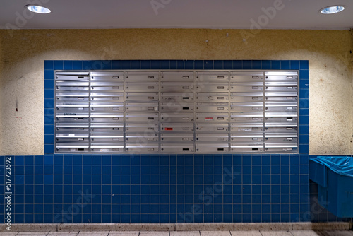 East Berlin apartment block mail room/boxes at night 