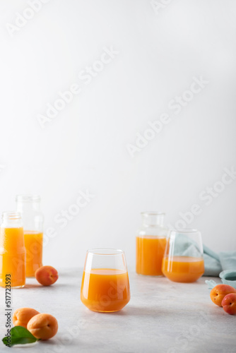 Summer apricot juice on the light background