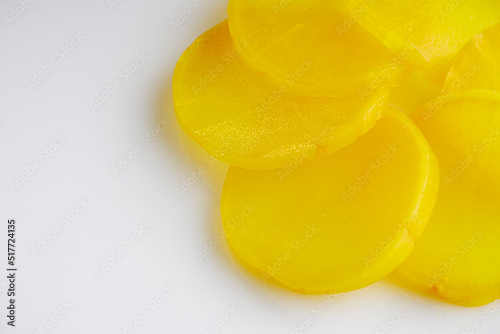 takuan traditional japanese marinated daikon radish on a white