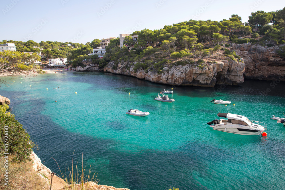 Mallorca, Spain - Boats in a cove in the mediterranean sea blue green color