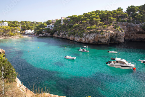Mallorca, Spain - Boats in a cove in the mediterranean sea blue green color © Tatiana