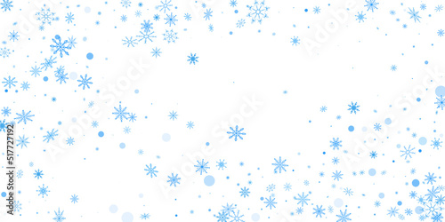 Blue delicate openwork snowflakes scatter on a white background. Festive background  postcard design  wallpaper