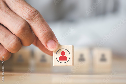 Hand holds wood cubes with person data, Customer psychology profile or characteristics, Buyer personal and target customer concept.