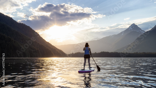 Adventurous Woman Paddle Boarding in a Lake around Canadian Mountain Landscape. Chilliwack Lake, British Columbia, Canada. Adventure Sport Travel © edb3_16