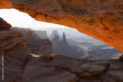 Scenic American Landscape and Red Rock Mountains in Desert Canyon. Spring Season. Sunset Sky. Mesa Arch in Canyonlands National Park. Utah, United States. Nature Background.