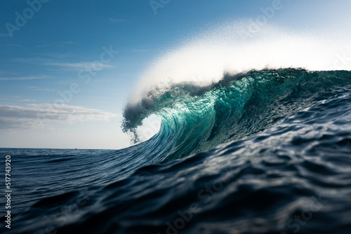Foamy waves rolling up in ocean photo