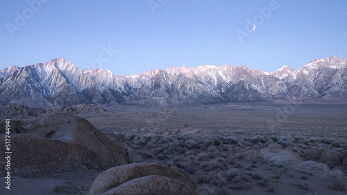 Mountain formations in wild nature in starry sky photo