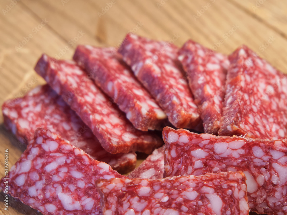Delicious sausage with lard. Lots of sausage slices, a macro shot. Delicious sausage with lard. Lots of sausage slices, a macro shot.