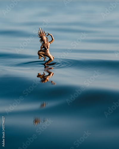 Statuette of Hindu goddess dancing on water photo