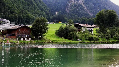 4K UHD Cinemagraph seamless video loop of a mountain lake in the Austrian alps with vibrant autumn leaves and reflection, close to Germany. The water is moving in circular waves, colorful fall trees. photo