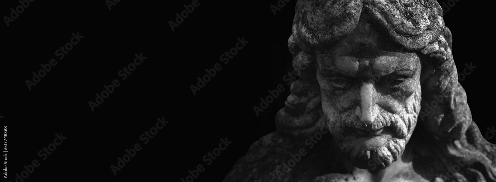 Antique stone statue Jesus Christ. Close up. Copy space.