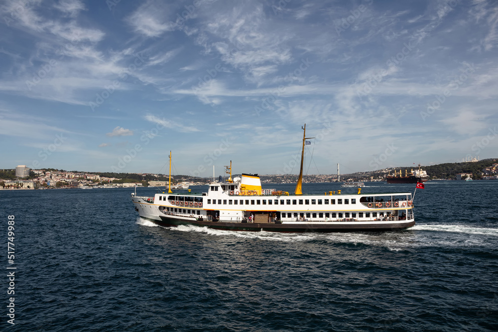 View of traditional ferry boat on Bosphorus in Istanbul. It is a sunny summer day.