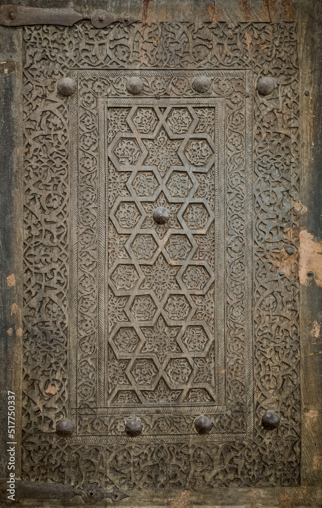 Close-up image of ancient doors with oriental ornaments