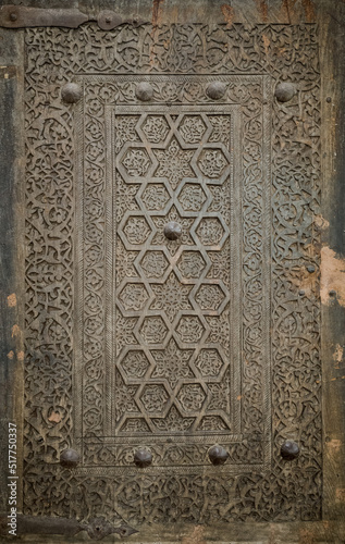 Close-up image of ancient doors with oriental ornaments