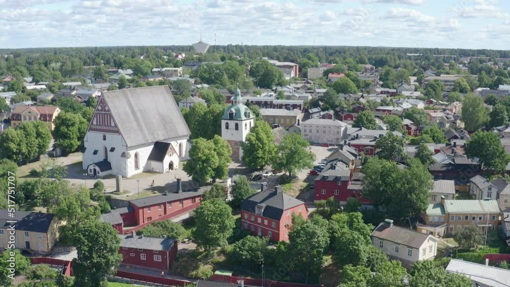Ascending the old town of porvoo with the church visible. Idyllic old houses and trees in between Ascending the old town of porvoo with the church visible. Idyllic old houses and trees in between