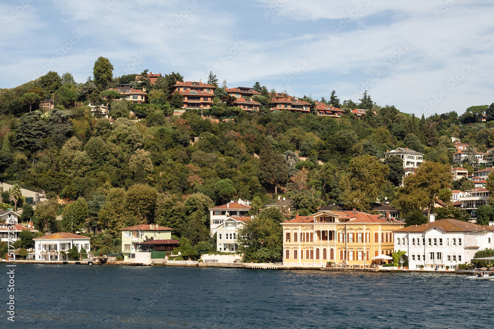 View of historical, traditional mansions by Bosphorus in Kandilli area of Asian side of Istanbul. It is a sunny summer day. Beautiful travel scene.