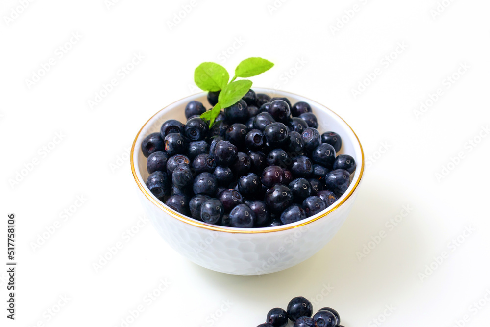 bowl of blueberries close-up on a white background bowl of blueberries close-up on a white background