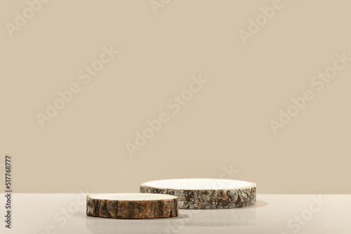 Wood slice podiums on beige background for cosmetic product mockup