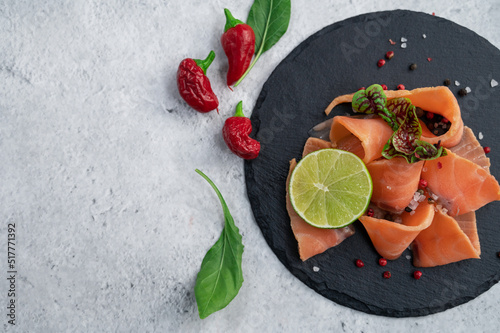 Fresh salmon slices with pe...