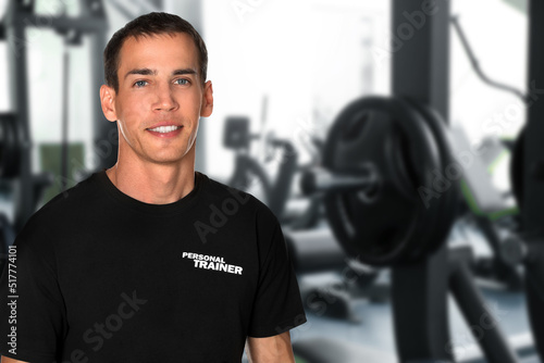 Portrait of professional personal trainer in gym. Space for text