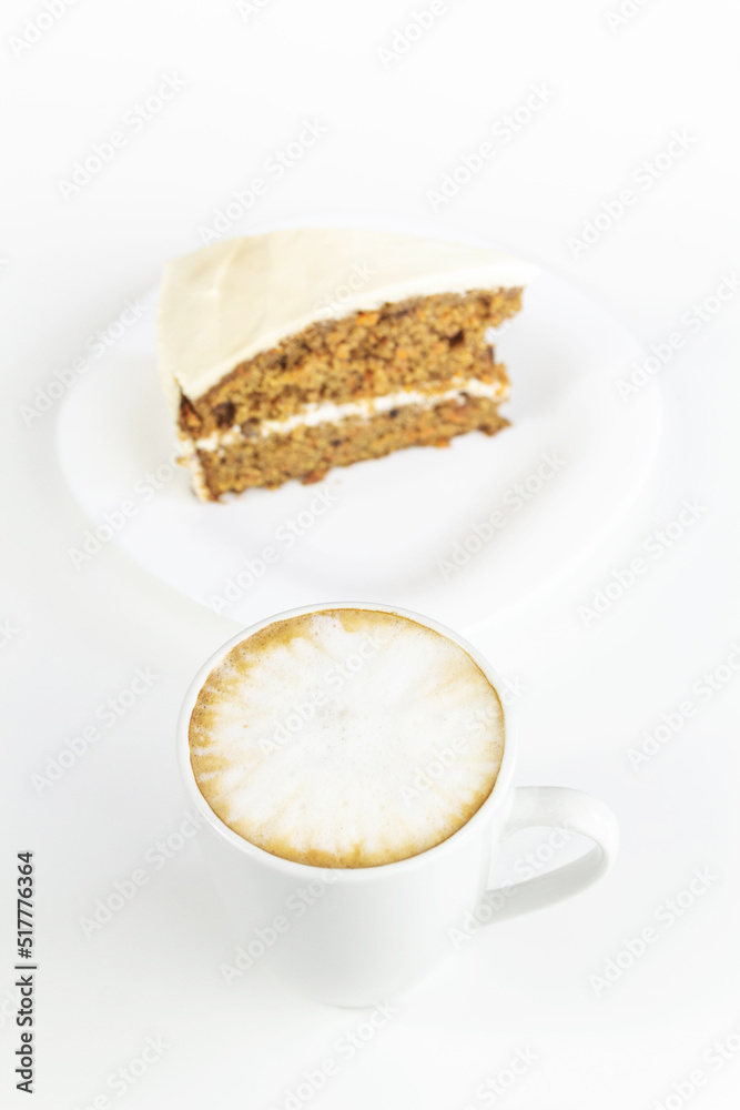 Cup of cappuccino coffee with a slice of cake Cup of cappuccino coffee with a slice of cake