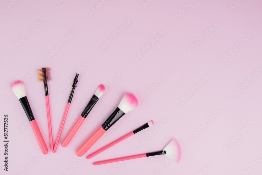makeup brushes on a pink background with copy space, beauty and fashion, cosmetics makeup brushes on a pink background with copy space, beauty and fashion, cosmetics