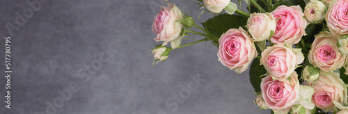 Beautiful bouquet of pink rose flowers on gray