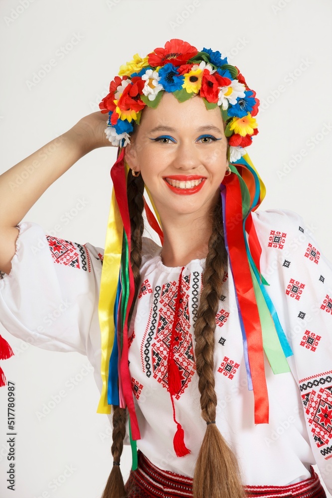 Beautiful Ukrainian girl in national costume vyshyvanka. Studio shoot on white background. Vse bude Ukraine Beautiful Ukrainian girl in national costume vyshyvanka. Studio shoot on white background. Vse bude Ukraine